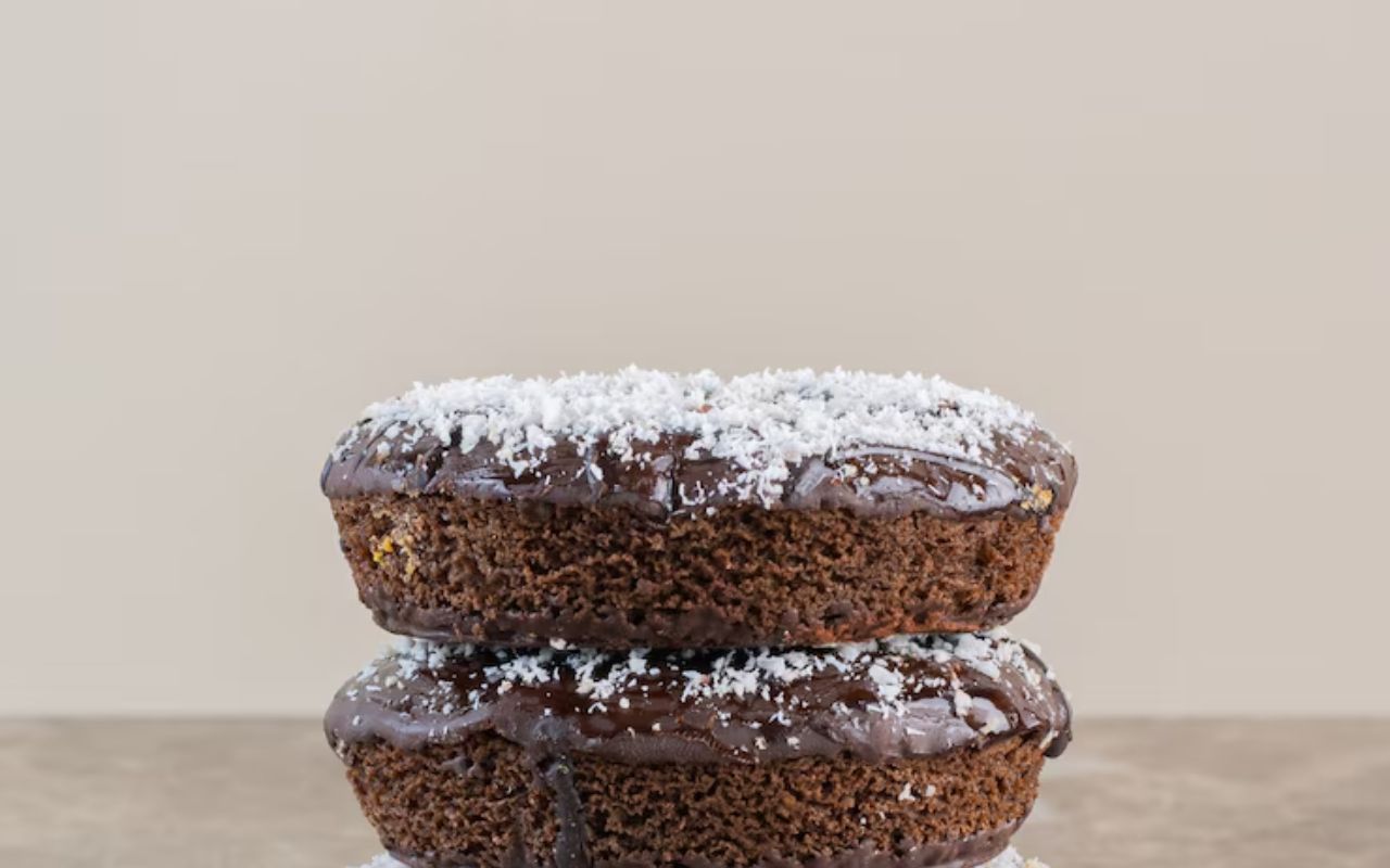 Stacked sugar-free chocolate brownies with icing and coconut