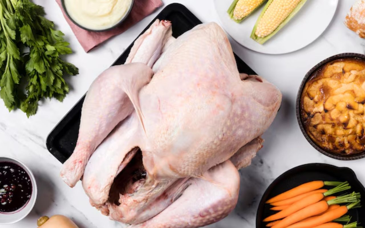 Whole raw turkey with vegetables