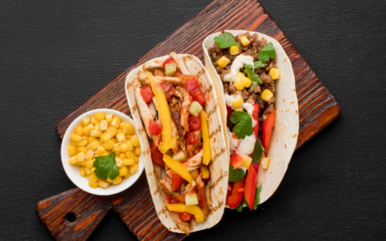 Tacos with avocado, veggies, and corn