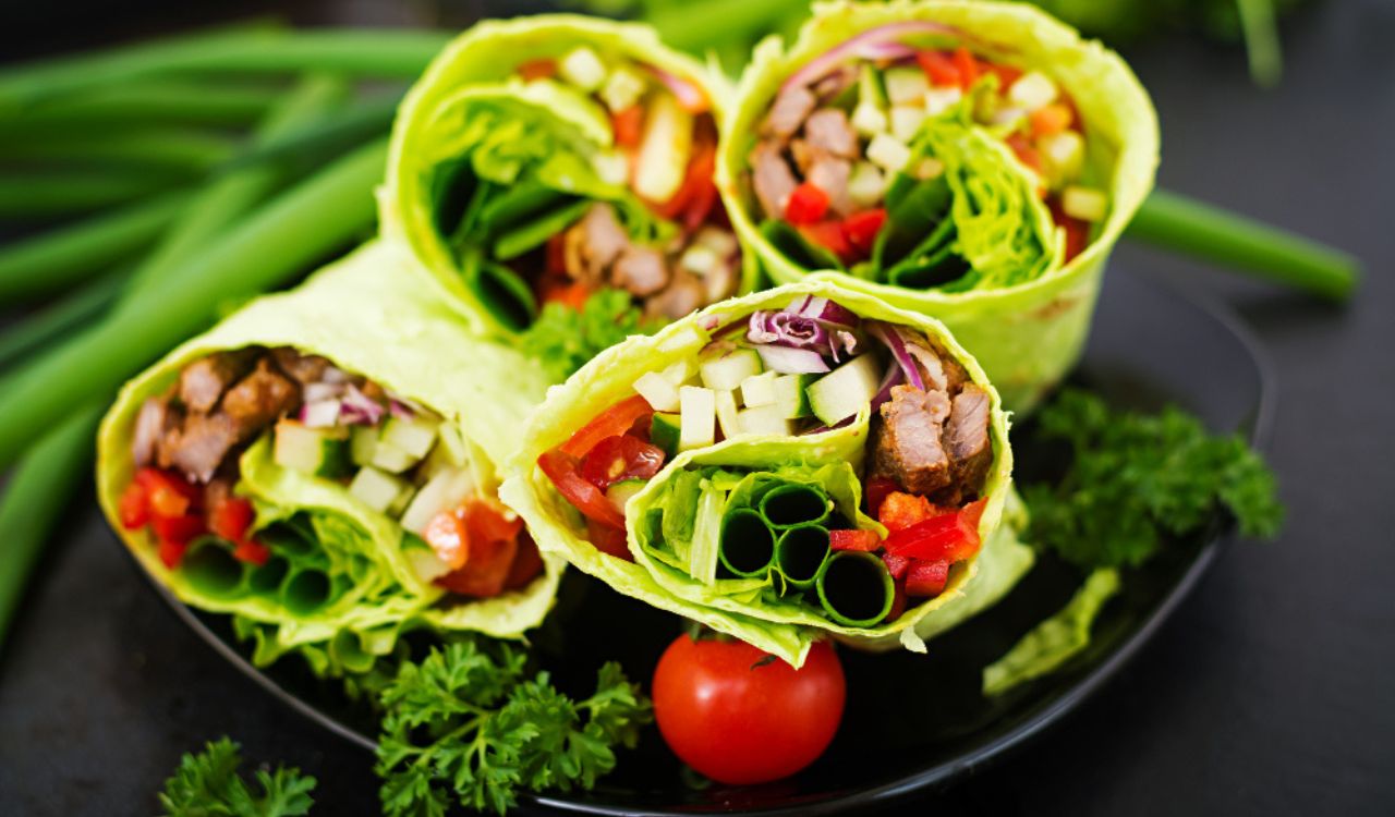 Shawarma from juicy beef, lettuce, tomatoes, cucumbers, paprika and onion