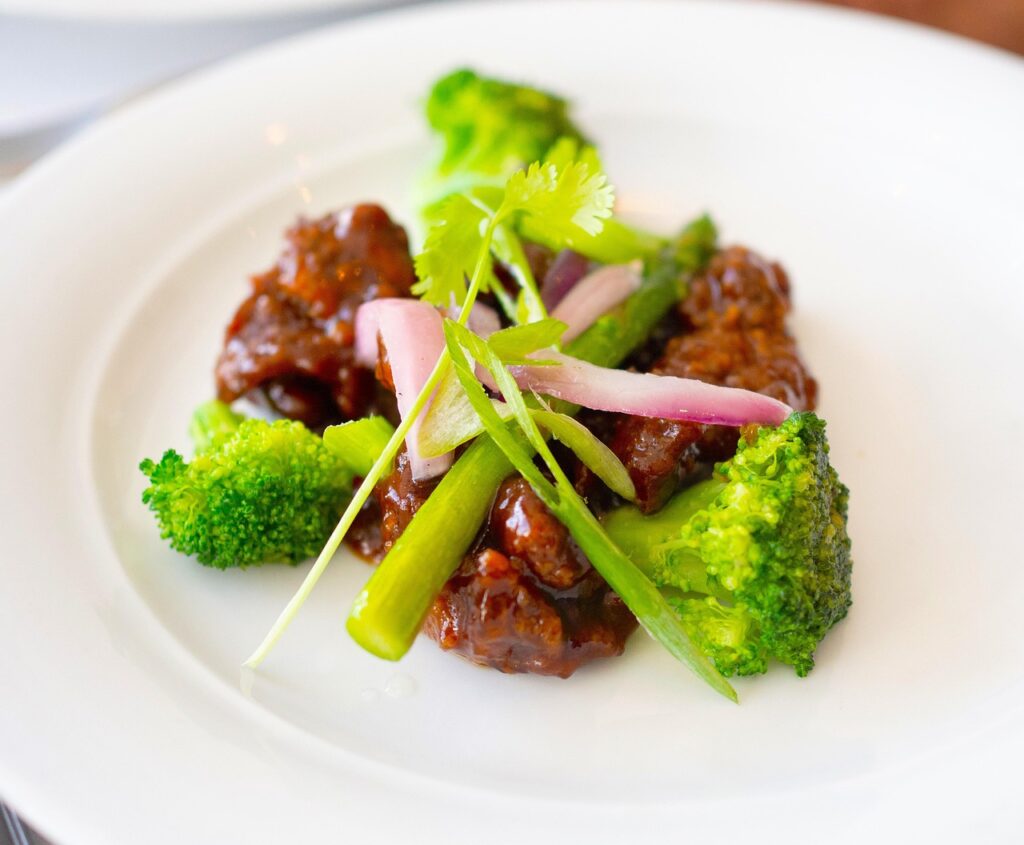 Tender slices of beef and crisp broccoli florets are tossed in a savory-sweet sauce made with soy sauce, garlic, and a hint of brown sugar. 