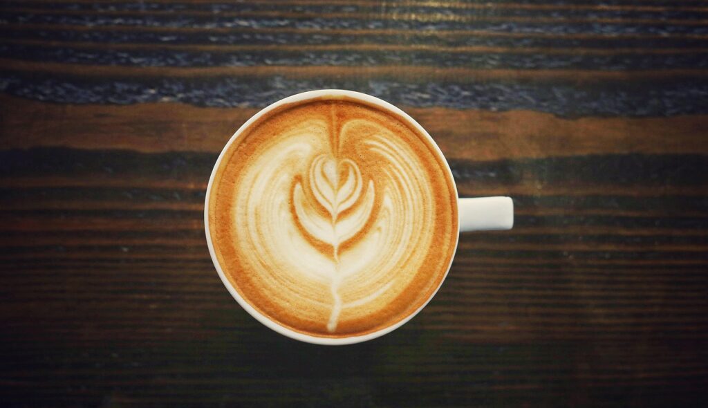 Colorful latte art on a beautifully prepared cup.
