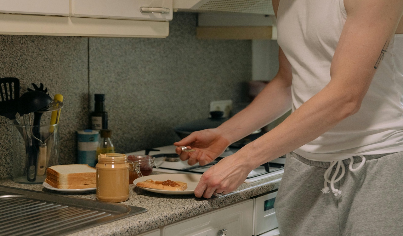 Person Preparing Food on Kitchen Counter Top