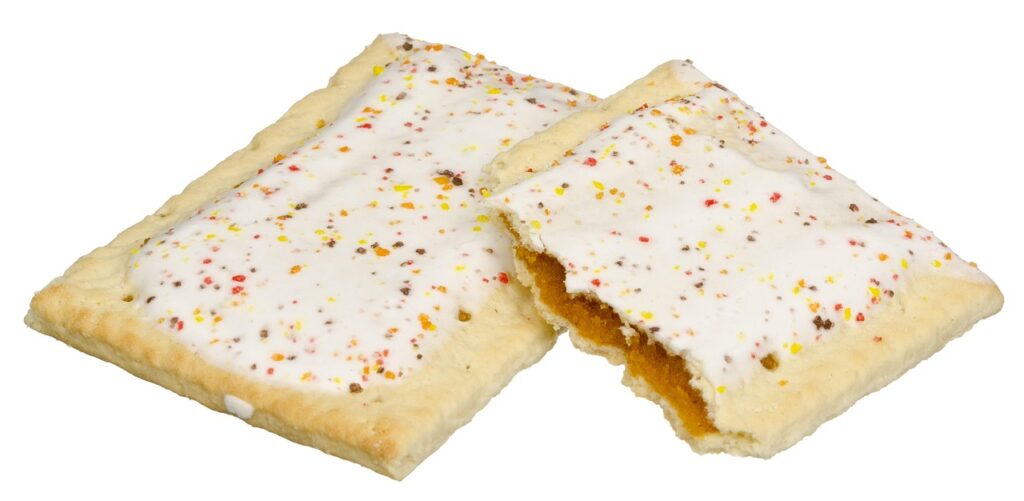 A plate with frosted Pop-Tarts, one with a bite taken.