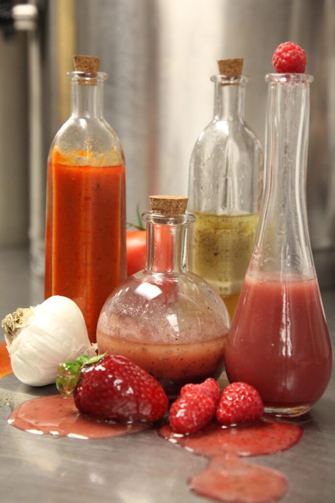 Ingredients representing sweet, salty, sour, and bitter on a board.