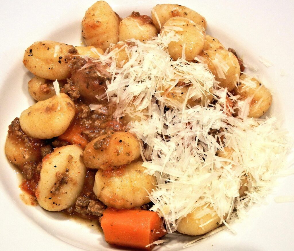 Soft gnocchi in a light sage butter sauce, topped with grated cheese.