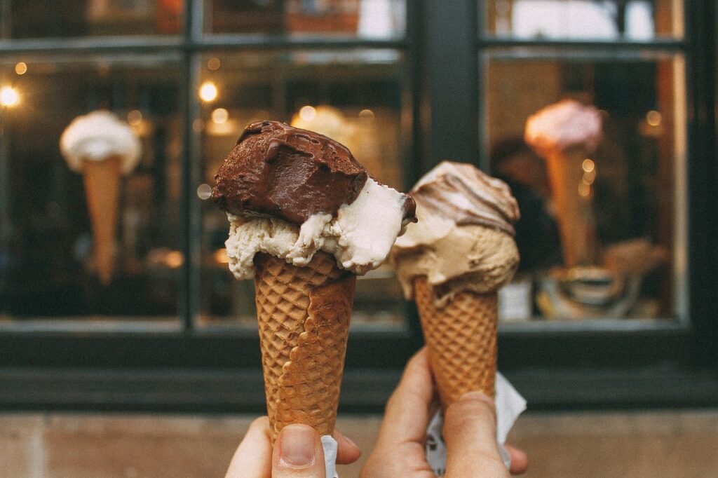 Nutella and chocolate ice cream scoop in a waffle cone.