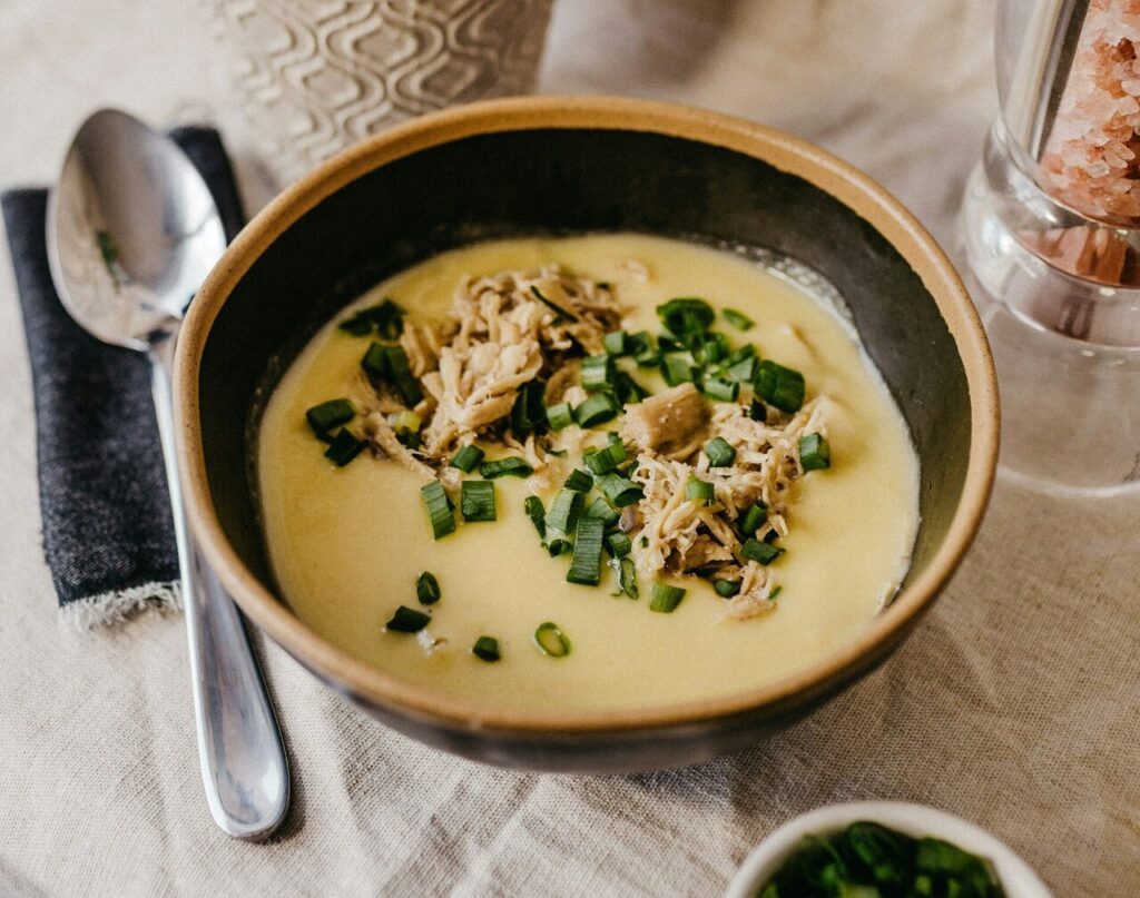 Creamy chicken and corn chowder in a soup bowl.