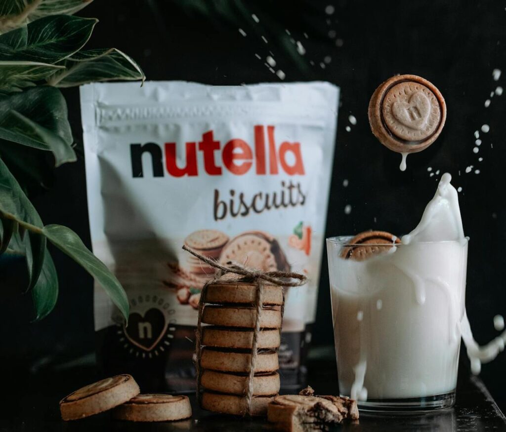 Cookies Falling into Glass of Milk