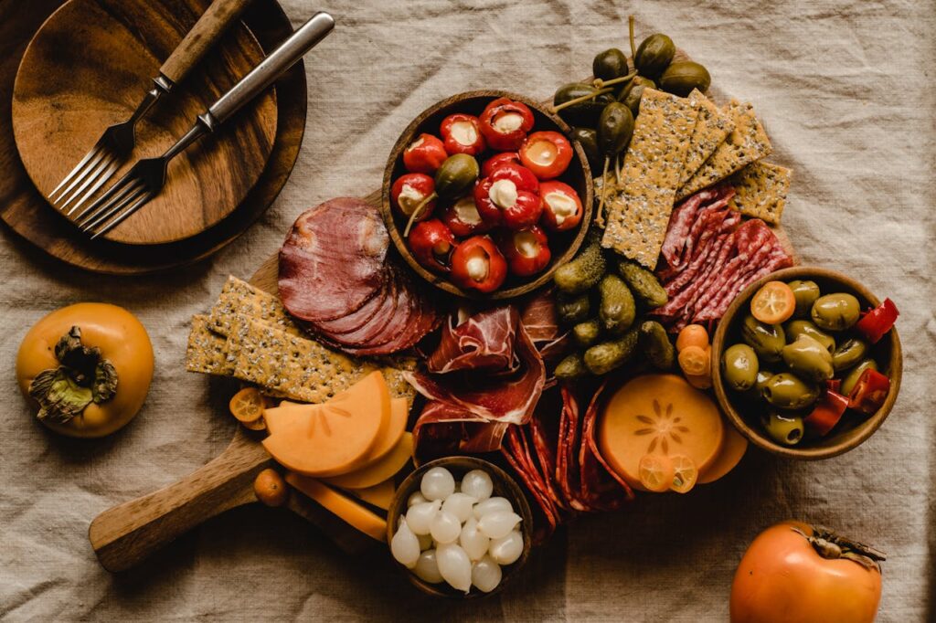 little compartmentalized packaging trays with crackers, meat, and cheese