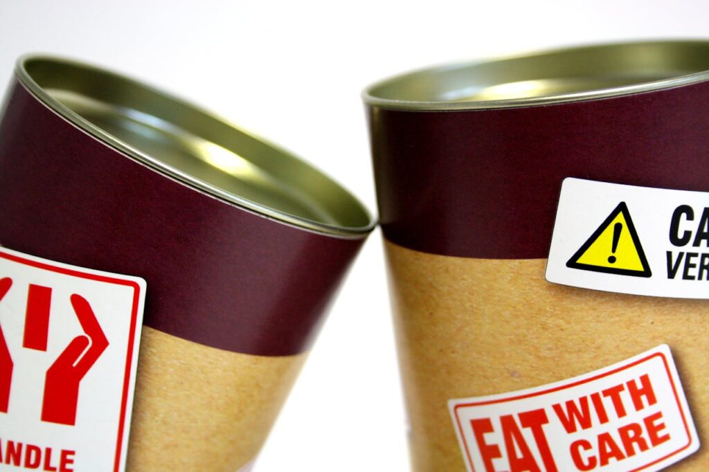 Two Cans With Signages