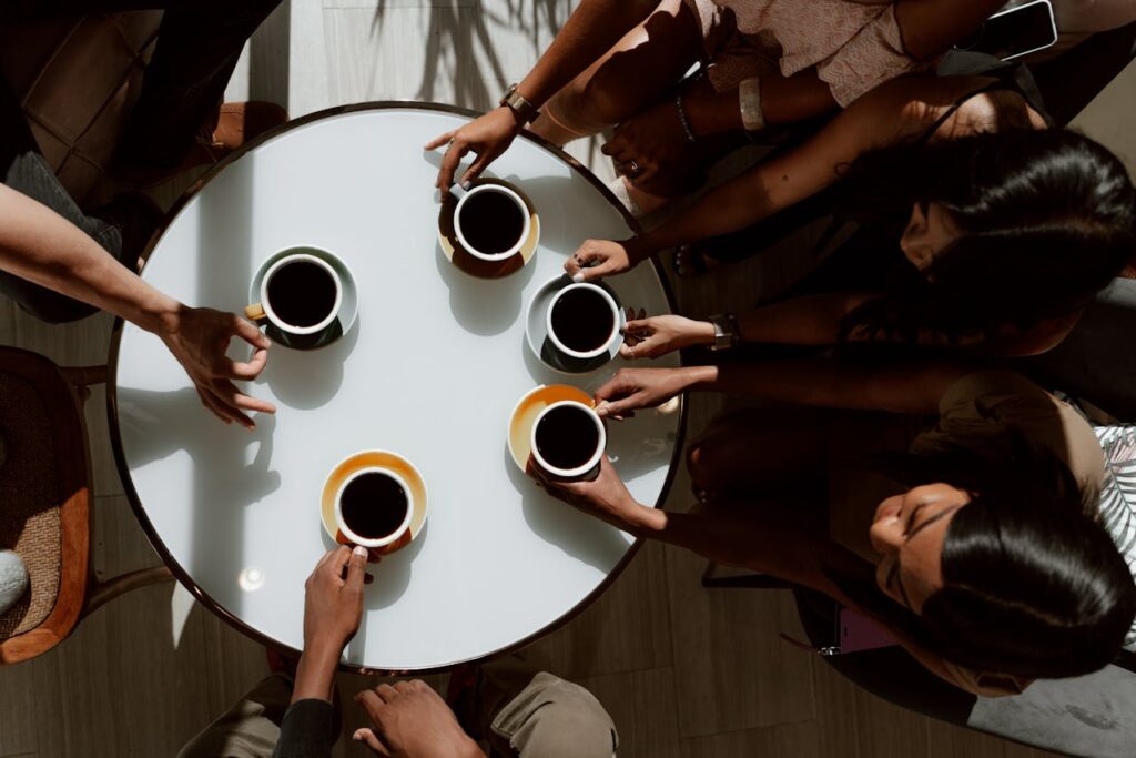 Friends chatting in a cozy coffee shop.