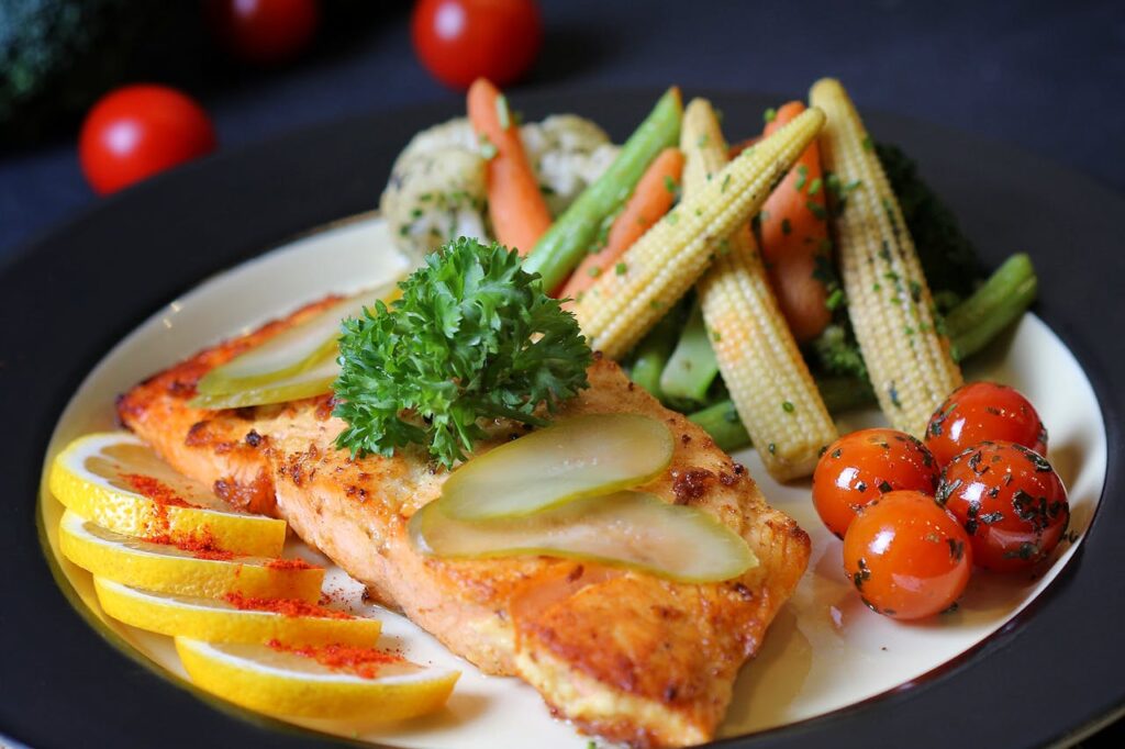 Flaked salmon over greens with lemon and herbs.