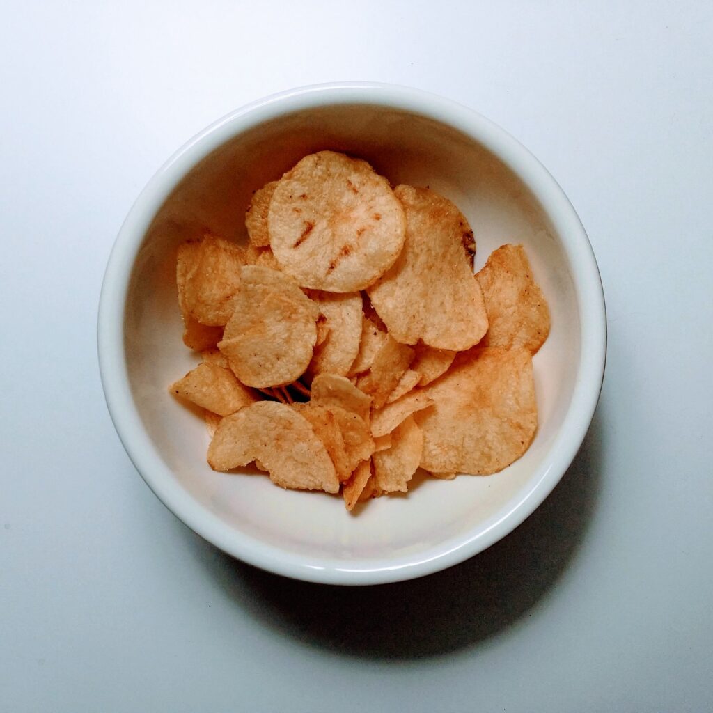 Potato chips, Bowl, White table image.