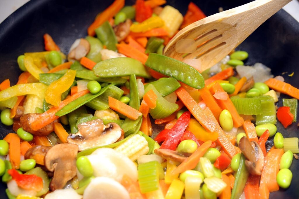 Brightly plated salad with colorful vegetables.