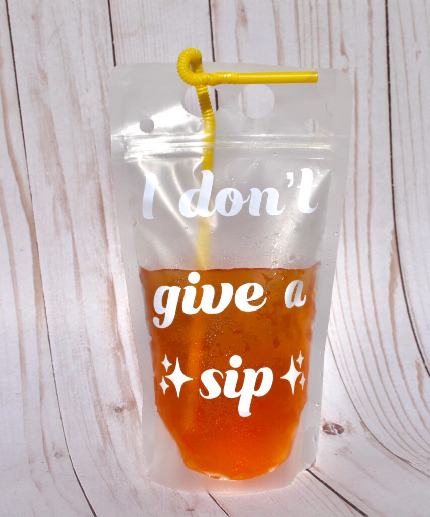 Silver Capri Sun pouch with straw inserted.