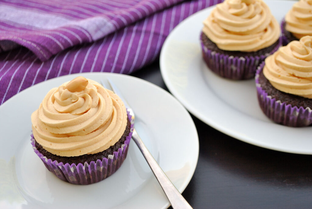 Cupcakes topped with peanut butter frosting.