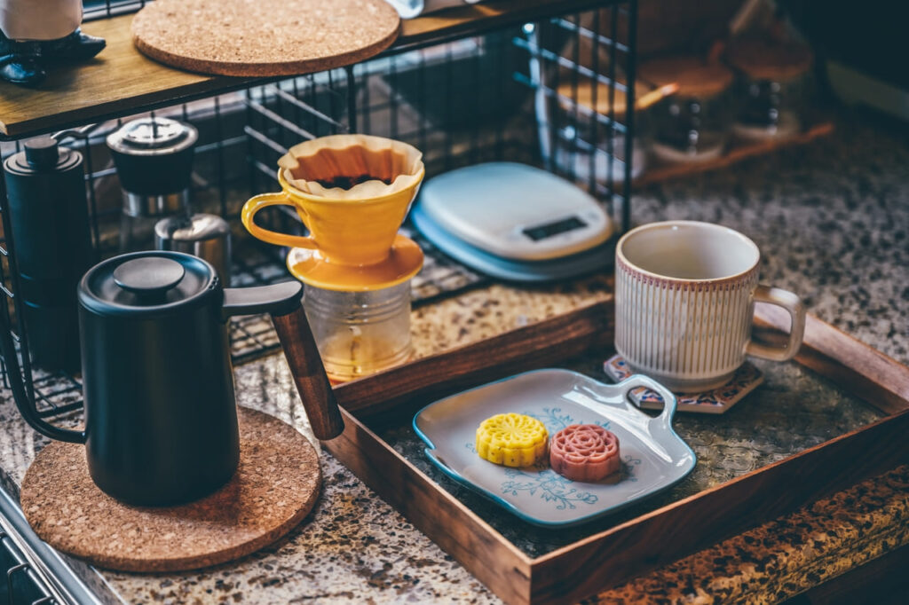 Cups of international coffee styles with assorted pastries.