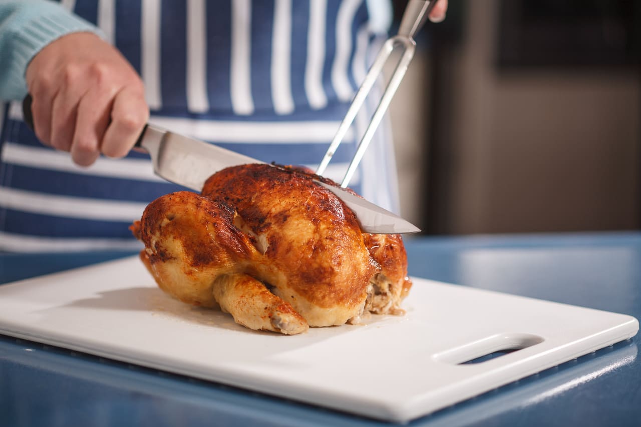 Whole Costco rotisserie chicken on a cutting board