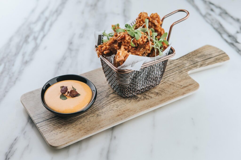 Crisp golden fried chicken pieces in basket