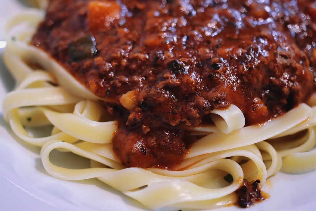 Tagliatelle smothered in rich meat sauce.